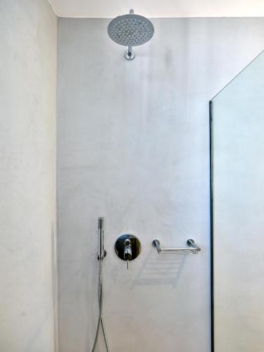 a shower in a bathroom with a glass door at Paros Gem in Naousa