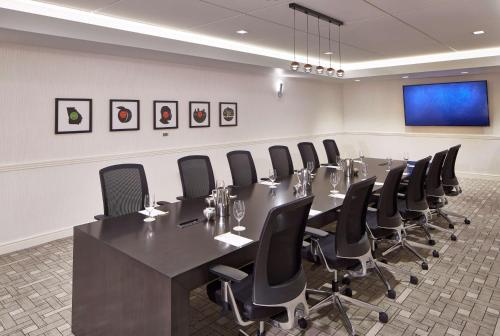 a conference room with a long table and chairs at Doubletree By Hilton Atlanta Perimeter Dunwoody in Atlanta