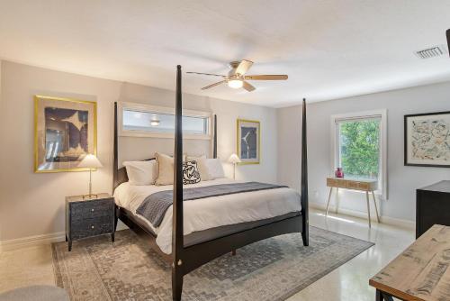 a bedroom with a bed and a ceiling fan at Mermaids Oasis - 315 in Bailey Hall