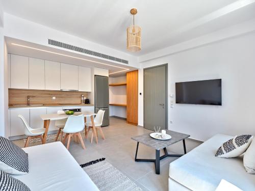 a living room with a couch and a table at Paros Gem in Naousa
