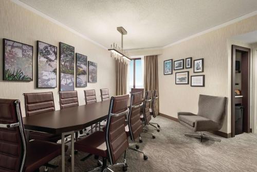 a conference room with a table and chairs at Embassy Suites by Hilton Chicago North Shore Deerfield in Deerfield