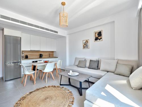 a living room with a couch and a table at Paros Gem in Naousa