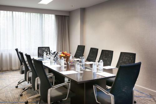 a conference room with a long table and chairs at DoubleTree by Hilton Hotel & Suites Houston by the Galleria in Houston