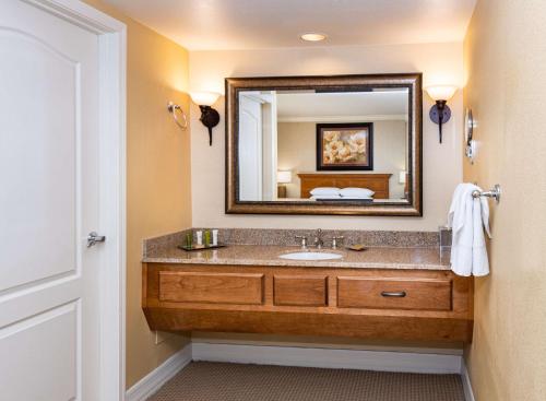 a bathroom with a sink and a mirror at Hilton Phoenix Resort at the Peak in Phoenix