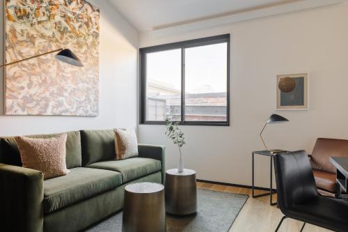 a living room with a couch and a table at Sonder RailSpur in Seattle