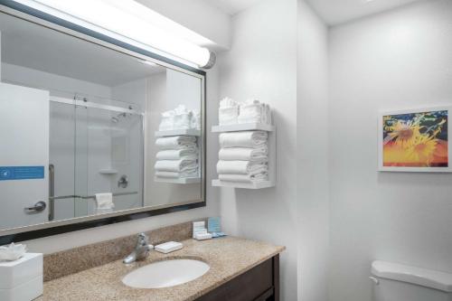 a white bathroom with a sink and a mirror at Hampton Inn & Suites Nashville Franklin in Franklin