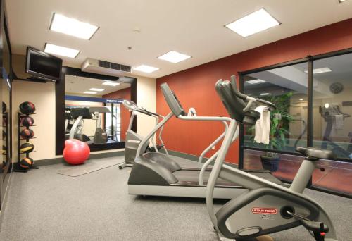 a gym with two exercise bikes and a treadmill at Hampton Inn Champaign/Urbana in Urbana