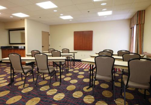 a conference room with tables and chairs and a podium at Hampton Inn Champaign/Urbana in Urbana