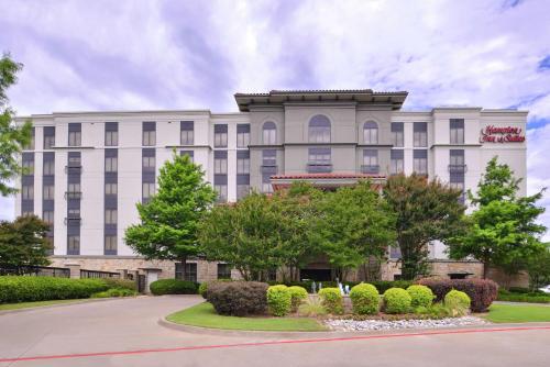 a large white building with trees in front of it at Hampton Inn & Suites Legacy Park-Frisco in Frisco