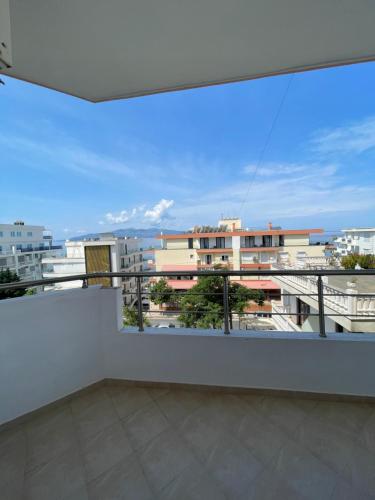 a balcony with a view of a city at Overview Apartments Saranda in Sarandë