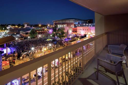 a balcony with a view of a city at night at Hampton Inn & Suites Memphis-Beale Street in Memphis