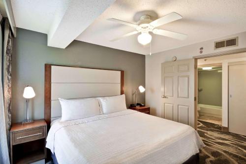 a bedroom with a white bed and a ceiling fan at Homewood Suites by Hilton San Antonio Northwest in San Antonio