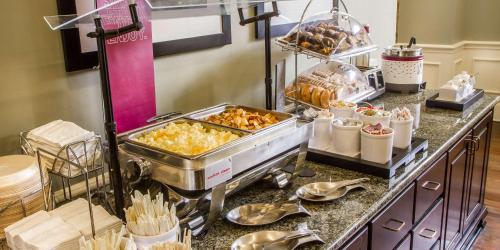 a buffet line with many different types of food at Hampton Inn & Suites Savannah Historic District in Savannah