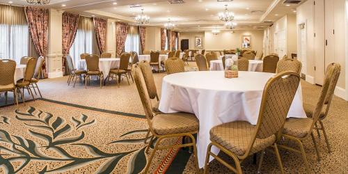 a conference room with a table and chairs in the middle at Hampton Inn & Suites Savannah Historic District in Savannah