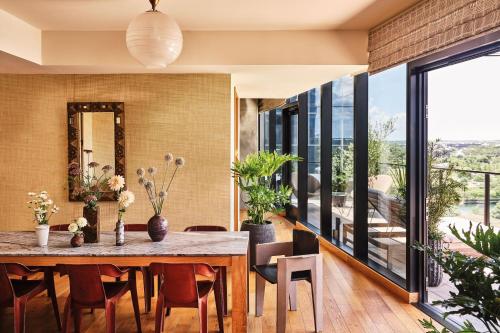 a dining room with a table and chairs at Austin Proper Hotel, a Member of Design Hotels in Austin