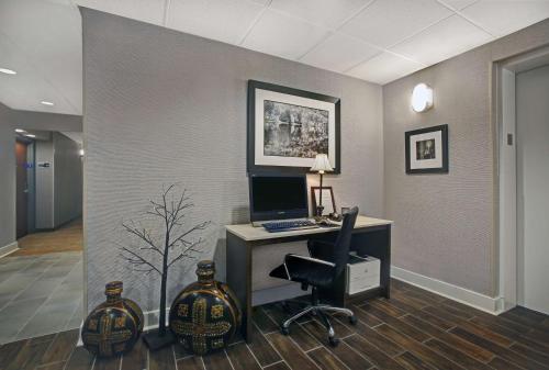 an office with a desk with a computer and a chair at Hampton Inn Salisbury in Salisbury