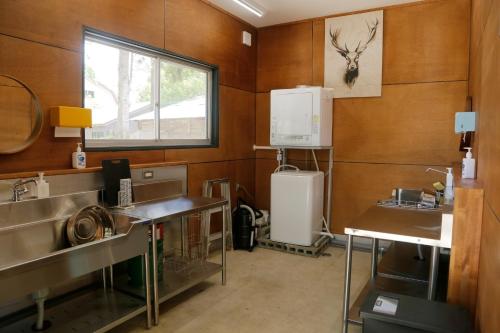 a kitchen with two sinks and a refrigerator at Black Hime Kai Taku - Vacation STAY 23194v in Shinano