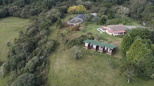 an aerial view of a house on a hill at Pousada Bracatinga in Bom Retiro