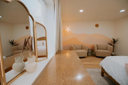 a bedroom with a dressing table and a mirror at East Downtown Desert Chic Casita-Hot Tub-Pet Friendly-No Pet Fees! in Albuquerque