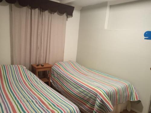 Ein Bett oder Betten in einem Zimmer der Unterkunft Casa frente al mar