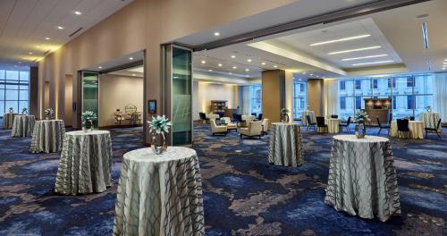 a row of tables in a room with chairs at Hilton Cleveland Downtown in Cleveland