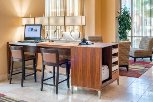 a kitchen with a desk with a computer on it at Hilton Vancouver Washington in Vancouver