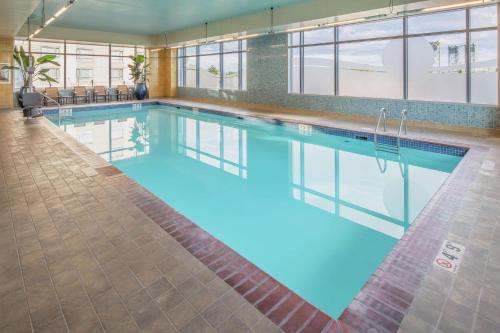a large pool with blue water in a building at Hilton Vancouver Washington in Vancouver