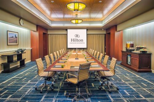 a large conference room with a long table and chairs at Hilton Vancouver Washington in Vancouver