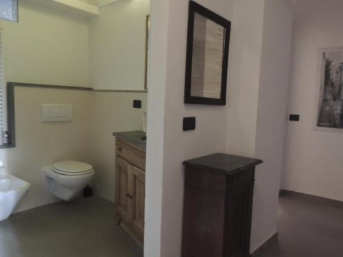 a bathroom with a toilet and a sink at La Casa Di Cocca in Alba