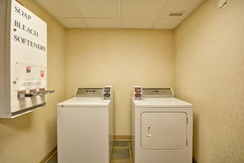 two washing machines sitting next to each other in a room at Hampton Inn Bozeman in Bozeman