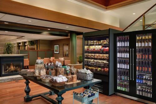 a store with a counter with bottles of wine at DoubleTree by Hilton Seattle Airport in SeaTac
