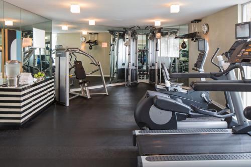 a gym with treadmills and machines in a room at Avalon Hotel Beverly Hills, a Member of Design Hotels in Los Angeles