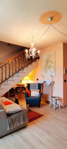 a living room with a staircase and a couch at Le rose di Mapi in Mango