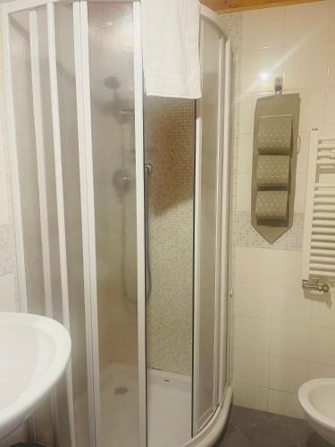 a bathroom with a shower and a sink at La stazione di posta in Cantiano