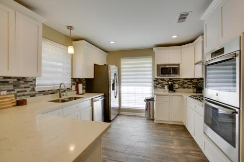 a kitchen with white cabinets and a counter top at Spacious Baton Rouge Home Rental 12 Mi to LSU! in Baton Rouge