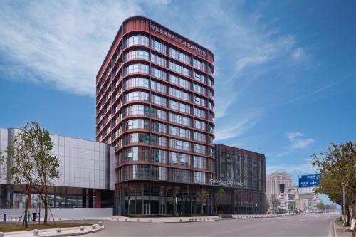 a rendering of a tall building in a city at Four Points by Sheraton Chongqing, Yongchuan in Yongchuan