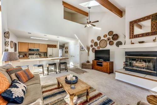 a living room with a couch and a fireplace at Bright Townhome - 1 Mile to Downtown Cloudcroft in Cloudcroft