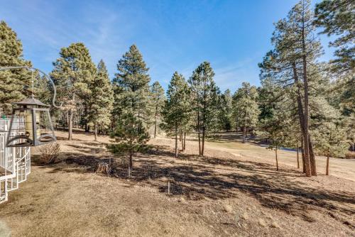 a park with trees and a playground at Bright Townhome - 1 Mile to Downtown Cloudcroft in Cloudcroft