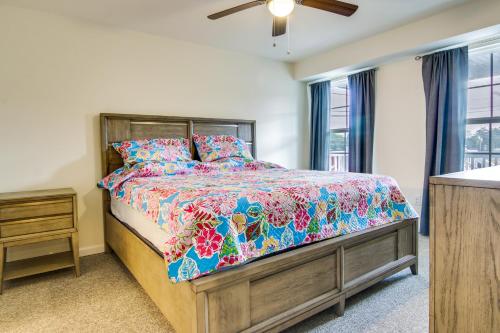 a bedroom with a bed with a colorful comforter at Rehoboth Beach Vacation Rental with Community Pool! in Rehoboth Beach