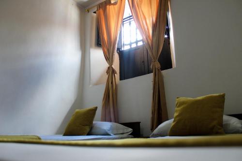 Hotel Colonial San Felipeにあるベッド