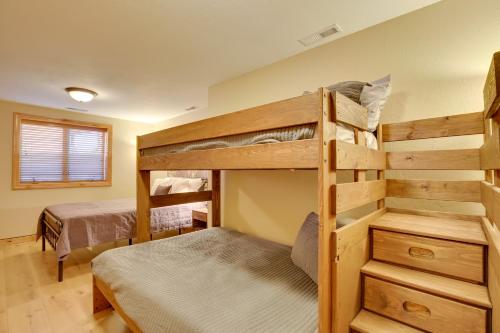 a bedroom with two bunk beds in a room at Hot Tub and Golf Course Views Luxe Sturgis Home! in Sturgis