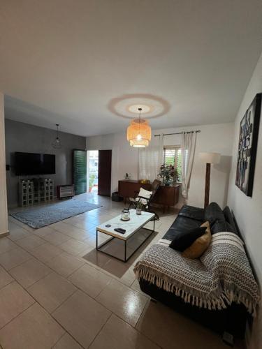 a living room with a couch and a table at Green Door Apartment in Limassol