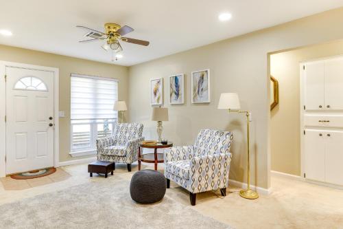 a living room with two chairs and a table at Cozy Oklahoma Retreat with Covered Patio and Gas Grill in Mustang