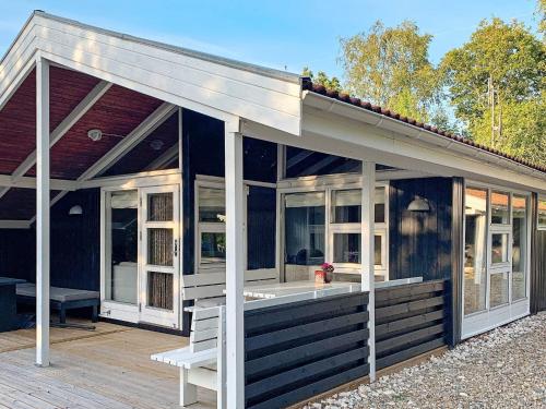 a large screened in porch of a house at 4 person holiday home in Oksbøl-By Traum in Oksbøl