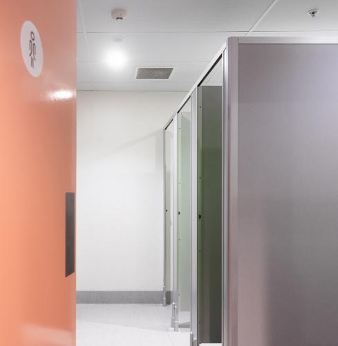 a hallway with a glass door in a building at LyLo Queenstown in Queenstown
