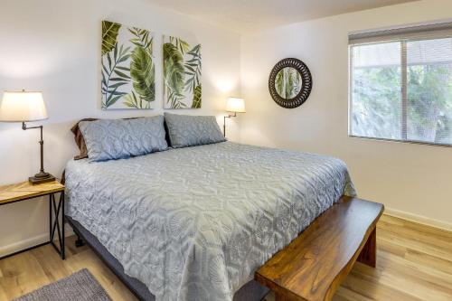 a bedroom with a bed and a window at Renovated Crescent Lake Escape with Waterfront Deck! in Crescent City