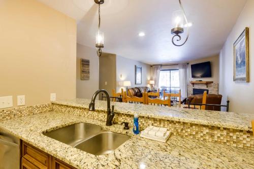 a kitchen with a sink and a counter top at Chic and Cozy Breck Condo Ski-InandSki-Out at Peak 8! in Breckenridge