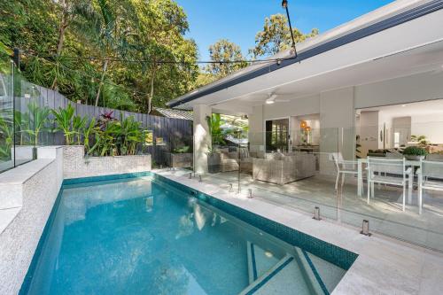 a swimming pool in the backyard of a house at Burleigh Beach House in Gold Coast
