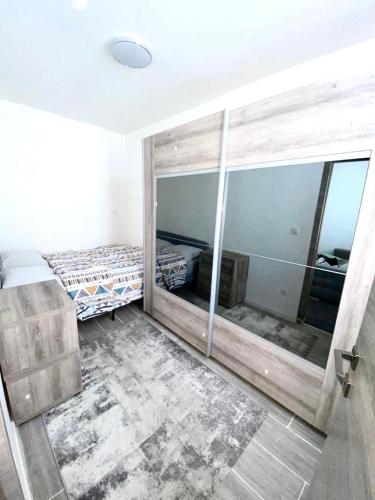 Ένα ή περισσότερα κρεβάτια σε δωμάτιο στο appartement douvres