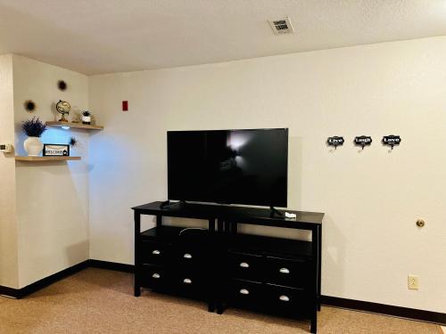 a living room with a flat screen tv on a wall at Rustic ridge 01 in Gatlinburg